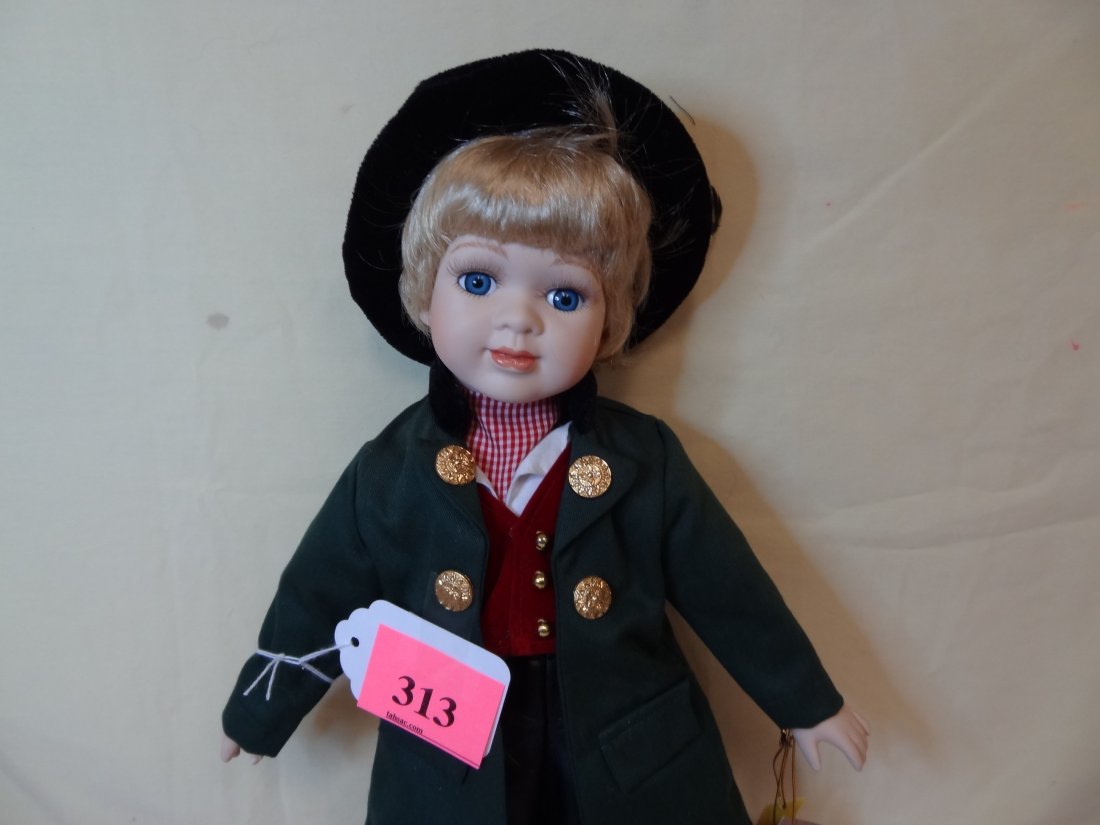 16'' DOLLS OF ALL NATION ''LITTLE MR. GERMANY'' BI: 16'' DOLLS OF ALL NATION ''LITTLE MR. GERMANY'' BISQUE HEAD AND LIMBS, CLOTH BODY, BLUE GLASS EYES, BLONDE HAIR, WIND UP MUSIC DOLL, MARKED ''THE DOLL CONNOISSEUR DOLL COLLECTION SEYMOUR MANN INC''