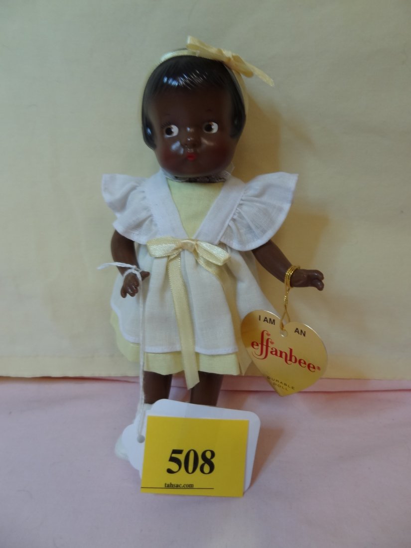 8.5'' EFFANBEE BLACK PATSYETTE, PLASTIC DOLL, BLAC: 8.5'' EFFANBEE BLACK PATSYETTE, PLASTIC DOLL, BLACK PAINTED HAIR, BROWN PAINTED EYES, MOVABLE LIMBS, ADORABLE YELLOW AND WHITE COSTUME WITH HEADBAND, MARKED ON BODY PLUS PAPER LABEL