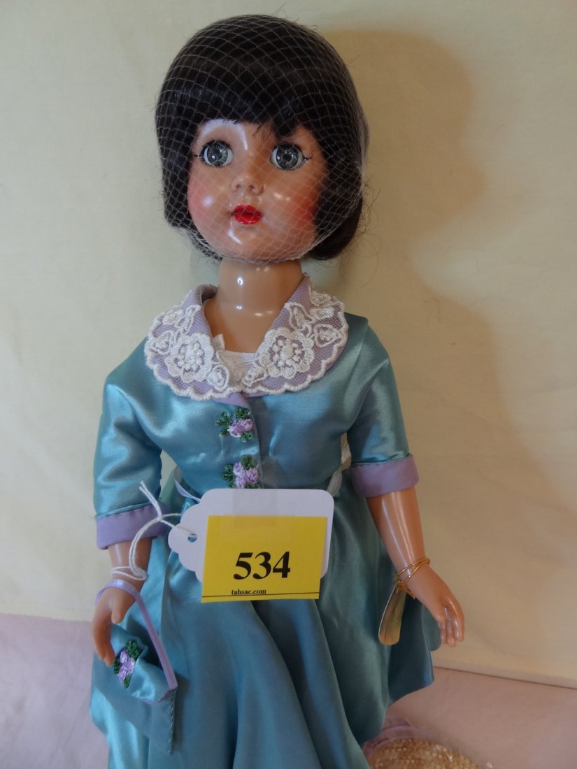 18'' EFFANBEE ''HONEY WALKER'' DOLL, PLASTIC HEAD: 18'' EFFANBEE ''HONEY WALKER'' DOLL, PLASTIC HEAD AND BODY, BLUE GLASS SLEEPY EYES, DARK BROWN HAIR, 1950'S CIRCA CHRISTIAN DIOR STYLE GREEN SATIN DRESS HAT, BAG AND SHOES, MARKED EFFANBEE HONEY 1997