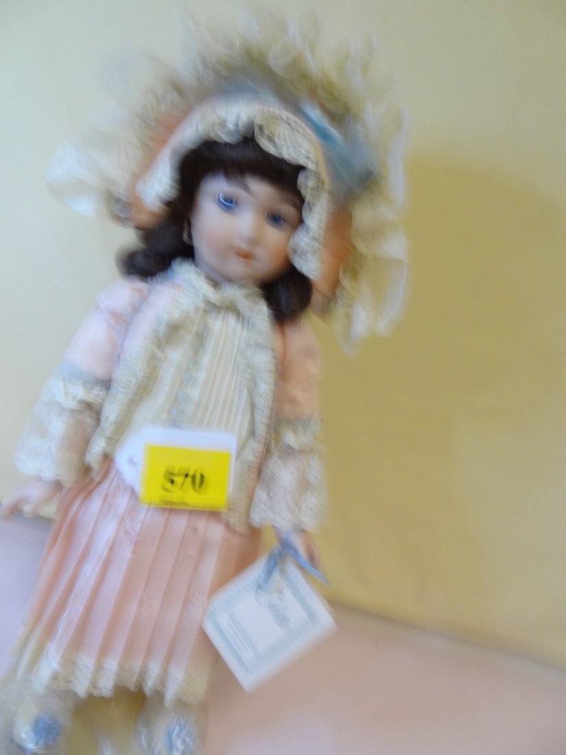 17'' BISQUE HEAD, HANDS AND FEET, ''COLETTE'' BROW: 17'' BISQUE HEAD, HANDS AND FEET, ''COLETTE'' BROWN HAIR WITH BLUE GLASS EYES, STYLED FROM JUMEAU LONG FACED ''BEBE'' REPRODUCTION BY HAMILTON COLLECTION 1989