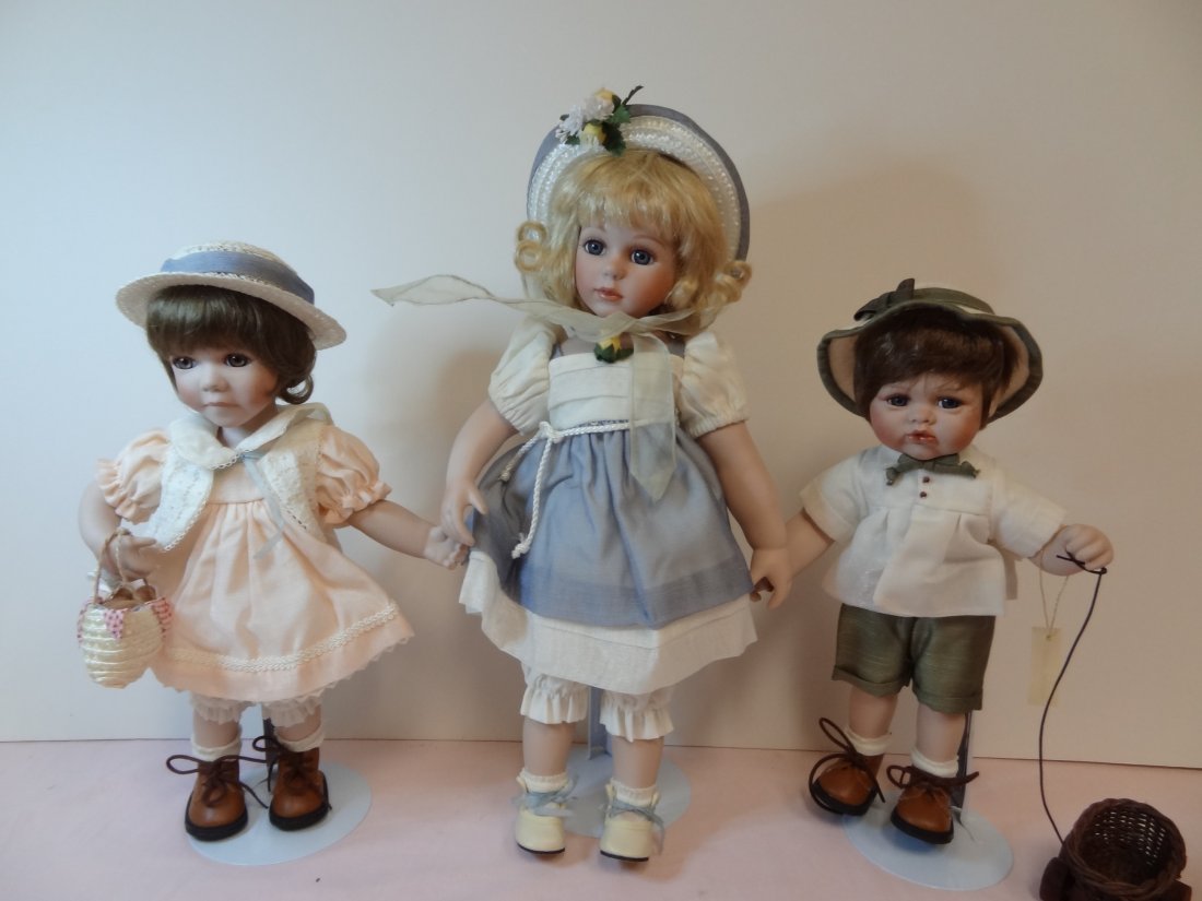 THREE SEYMOUR MANN SIBLING DOLLS, BISQUE HEAD AND: THREE SEYMOUR MANN SIBLING DOLLS, BISQUE HEAD AND LIMBS, CLOTH BODILESS, 17'' BIG SISTER BLUE GLASS EYES, BLONDE HAIR, ADORABLE BLUE SUMMER DRESS AND HAT, 13'' SMALL GIRL HAS BROWN GLASS EYES, BROWN H