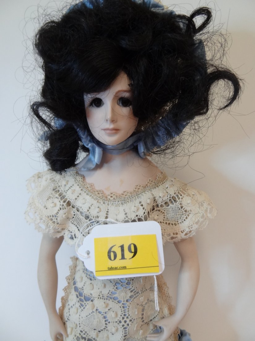 19'' 1974 SUZANNE GIBSONBISQUE HEAD, ARMS,: 19" MARKED "1974 SUZANNE GIBSON" ON BACK SHOULDER BLADE. BISQUE HEAD, ARMS AND LEGS, WITH CLOTHE BODY AND BLACK WIG, BLACK FULL EYE LASH, BROWN GLASS EYES, WEARING ELEGANT LACE DRESS AND BONNET.