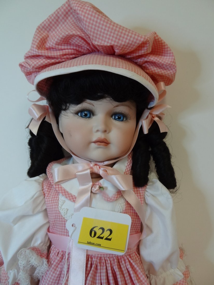 24 1/2'' TALL, ALL BISQUE DOLL, JOINTED HEAD, ARMS: 24 1/2'' TALL, ALL BISQUE DOLL, JOINTED HEAD, ARMS AND LEGS. A ''SEYMOUR MANN'' DOLL, BLACK HAIR, SHARP ICY BLUE EYES, SOFT PINK CHECKER WITH LACE DRESS AND BONNET. NUMBER ''654052.'' -- ''K * R, SIMO