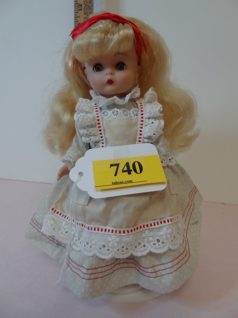 9'' ''1988 EFFANBEE DOLL'', PLASTIC, GREEN SLEEPY: 9'' ''1988 EFFANBEE DOLL'', PLASTIC, GREEN SLEEPY EYES, BLONDE HAIR, ADORABLE DRESS WITH LACE AND RED BOWS, VERY CUTE DOLL WITH STAND INCLUDED