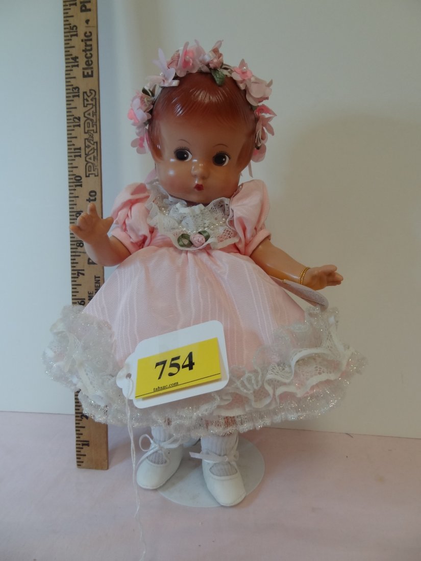 13'' 'EFFANBEE PATSY' MARKS ON HEAD AND BACK: 13" 'EFFANBEE PATSY' MARKS ON BACK OF HEAD AND BETWEEN SHOULDER BLADES; ALL PLASTIC DOLL, PAINTED BROWN-BLACK EYES, PINK DRESS WITH WHITE LACE AND FAUX PEARLS. COMES WITH FLORAL HEAD BAND, DRESSED WIT