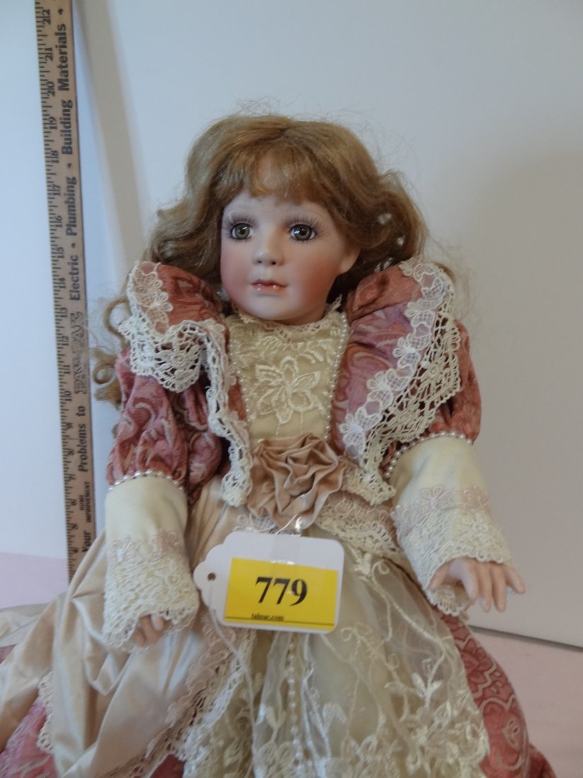 19'' MARKED: JANIS BERARD #985/7500, ALL BISQUE DO: 19'' MARKED: JANIS BERARD #985/7500, ALL BISQUE DOLL WITH JOINTED LIMBS, LONG FLOWING CURLY GOLDEN BROWN HAIR, HONEY BROWN HAZEL EYES, OPEN NOSTRILS, ELEGANT SILKY VICTORIAN GOWN WITH LACE TRIM WITH F