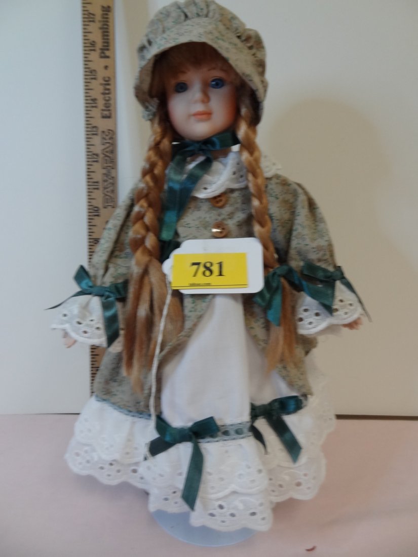 16'' BISQUE HEAD LIMBS AND CLOTHE BODY, REDDISH BL: 16" BISQUE HEAD AND LIMBS,CLOTHE BODY, REDDISH BLONDE HAIR IN PIG TAILS, BLUE GLASS EYES, DRESSED EARLY AMERICAN PILGRIM STYLE, NO VISIBLE MARKS.
