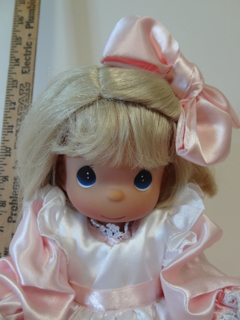 12'' MARKED: 2008, PMI LICENORE, PRECIOUS MOMENTS : 12'' MARKED: 2008, PMI LICENORE, PRECIOUS MOMENTS CO, MADE IN PHILIPINES; ALL PLASTIC DOLL WEARING A PINK BOW IN HER BLONDE HAIR, PINK AND WHITE DRESS WITH WHITE DRESS SHOES. COMES WITH STAND.