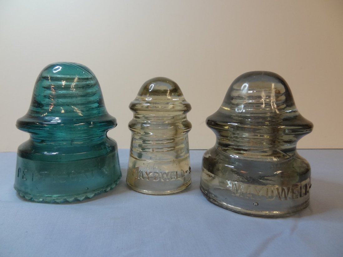 THREE NORTH AMERICAN GLASS INSULATORS MAY DWELL; #9 STR: THREE NORTH AMERICAN GLASS INSULATORS MAY DWELL; #9 STRAW 3 1/2'' TALL EXCELLENT CONDITION; #20 GRAY 4'' TALL EXCELLENT CONDITION. ONE H.G. CO. PATENT MAY 2, 1893 PETTICOAT AQUA 4'' TALL, GOOD CONDITI