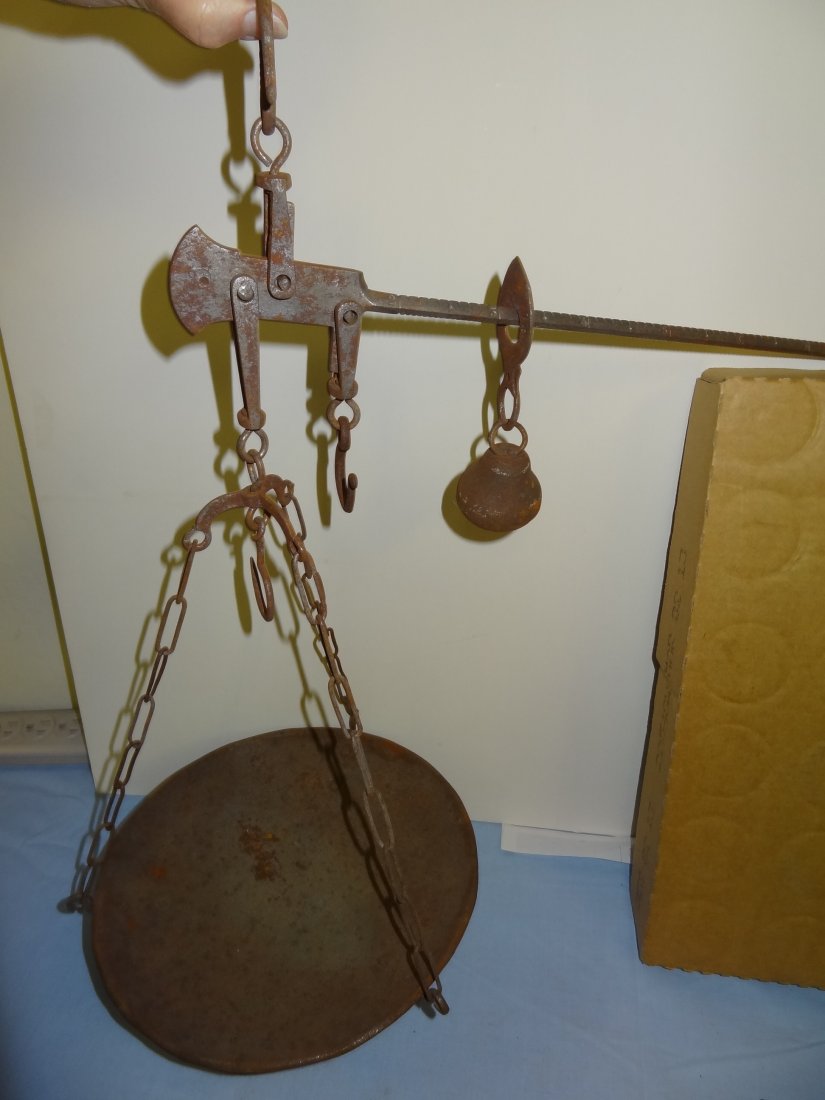 OLD METAL SCALE WITH CHAIN AND PAN. LONG ARM IS 16'' LO: OLD METAL SCALE WITH CHAIN AND PAN. LONG ARM IS 16'' LONG, THE PAN IS 10'' WIDE; HANGS 17 1/2'' LONG