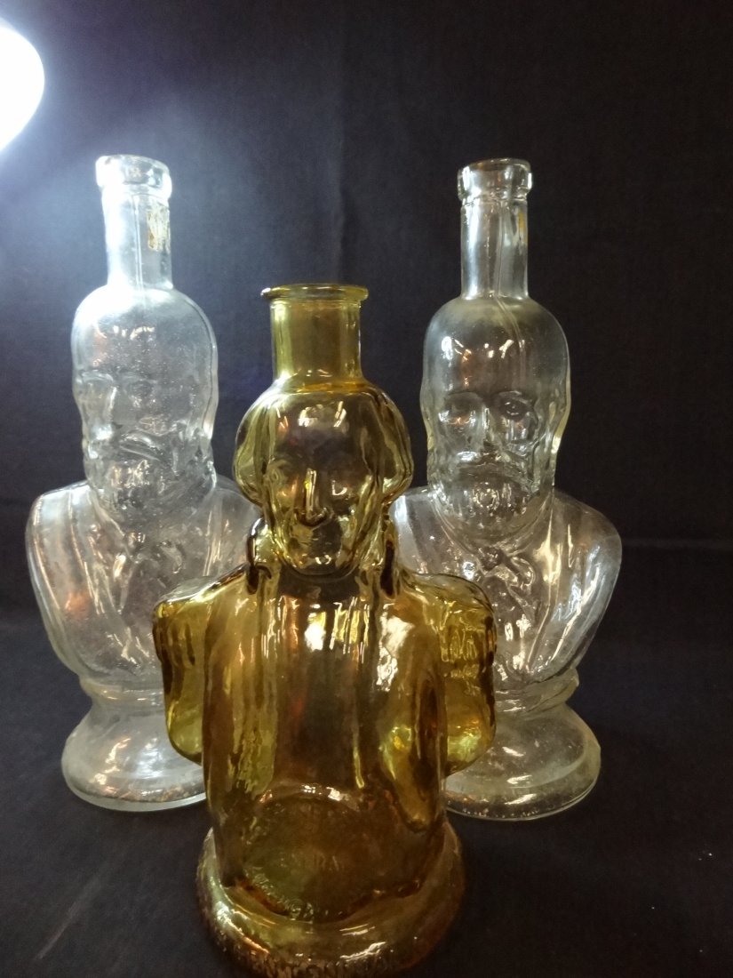 THREE VINTAGE BOTTLES: 1) ONE AMBER COLORED FIGURAL BOT: THREE VINTAGE BOTTLES: 1) ONE AMBER COLORED FIGURAL BOTTLE, CONTINENTAL GENERAL AMERICAN ARMY, SIMMONS CENTENNIAL BITTERS, MT. VERNON, VIRGINIA, 1832, MARKED WHEATON, NJ, 9.5'' TALL, GOOD CONDITION. 2