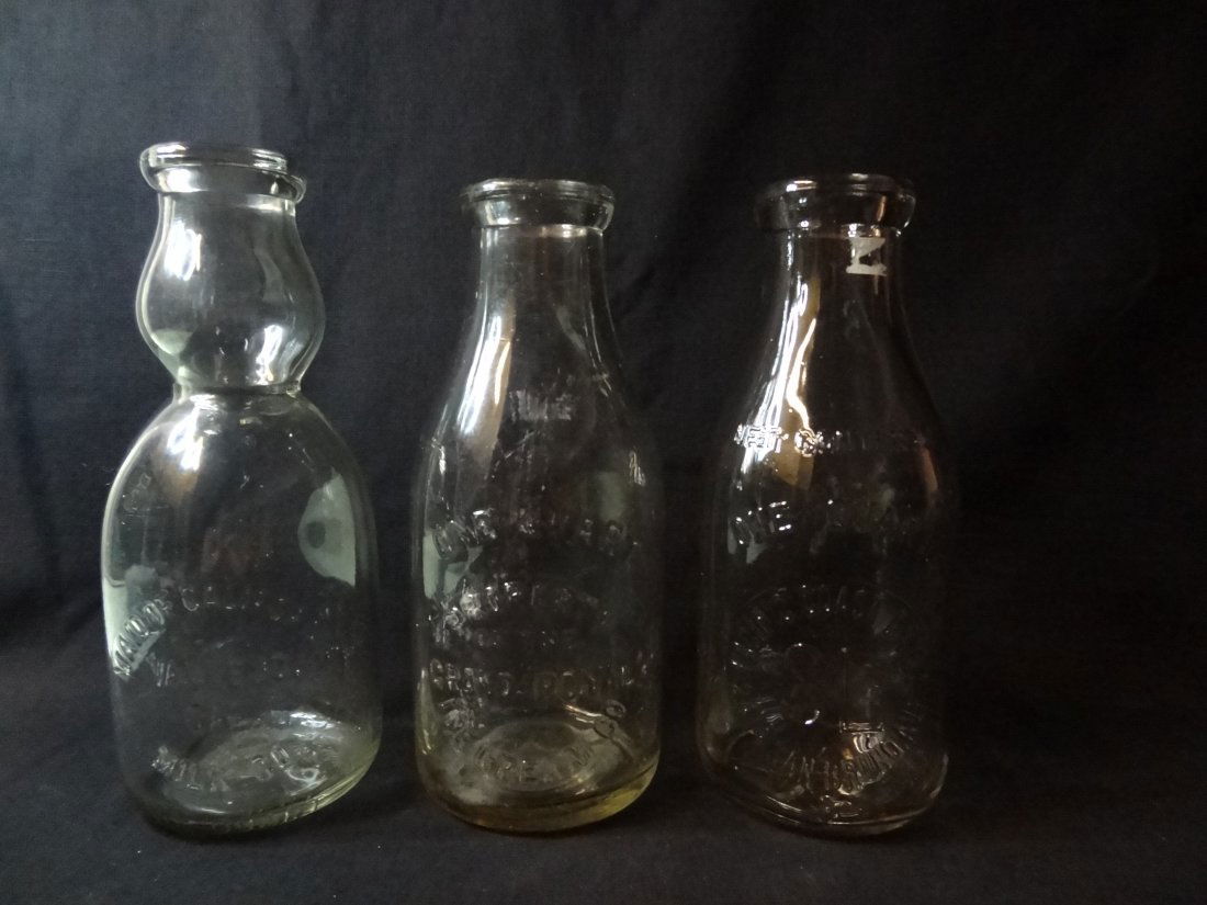 VINTAGE CLEAR GLASS MILK BOTTLES; 1) MADE OF CALIFORNIA: VINTAGE CLEAR GLASS MILK BOTTLES; 1) MADE OF CALIFORNIA MILK COMPANY / VALLEJO CALIFORNIA 1 QUART 'MDC' DURAGLAS, 9.5'' TALL BY 3.75''; 2)GRAND ROYAL 'PROPERTY OF THE GRAND ROYAL ICE CREAM COMPANY' 9.