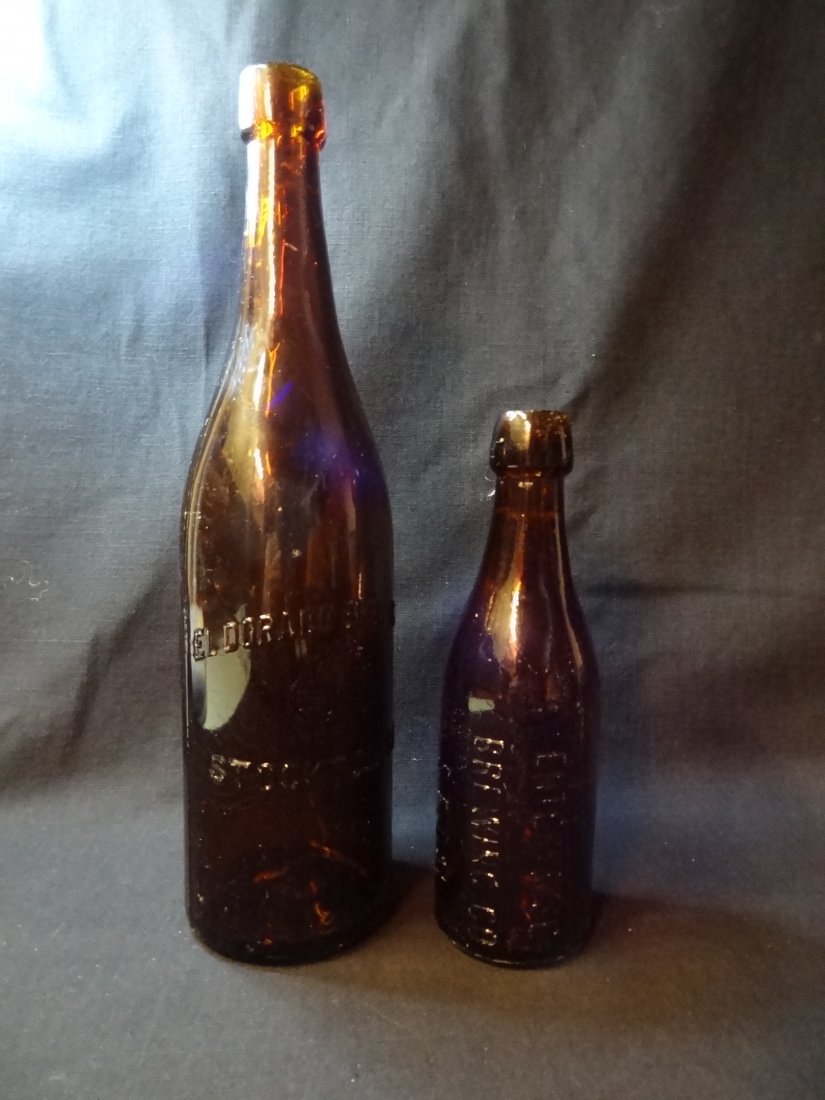 VINTAGE AMBER BEER BOTTLES; 1) EL DORADO BREWING CO STO: VINTAGE AMBER BEER BOTTLES; 1) EL DORADO BREWING CO STOCKTON,CA, BOTTOM EMBOSSED 424H, 12'' BY 3 1/8'', 2) ENTERPRISE BREWING CO S.F.CAL. BOTH BOTTLES IN GOOD CONDITION