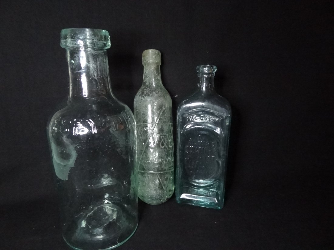 THREE VINTAGE AQUA BOTTLES. 1) 'ESPY PHIL.' WIDE MOUTH : THREE VINTAGE AQUA BOTTLES. 1) 'ESPY PHIL.' WIDE MOUTH BOTTLE 10'' BY 4'', SEE PHOTOS FOR 4'' CRACK ON NECK OF BOTTLE. 2)'DR. KILMER'S SWAMP-ROOT KIDNEY, LIVER & BLADDER CURE' / DR. KILMER & CO / BING