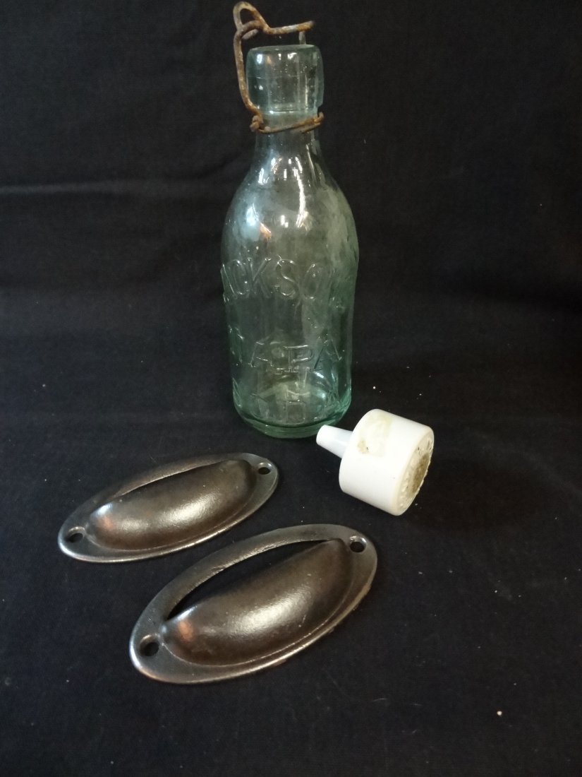 VINTAGE DRAWER PULLS, CERAMIC INSULATOR AND JACKSON'S N: VINTAGE DRAWER PULLS, CERAMIC INSULATOR AND JACKSON'S NAPA SODA BOTTLE: TWO 'PATENTED AUG. 6, 1856' METAL DRAWER PULLS, ONE CERAMIC 'PATENTED NOV. 1901' WHITE CERAMIC INSULATOR 2'' LONG'; ONE 7'' TALL