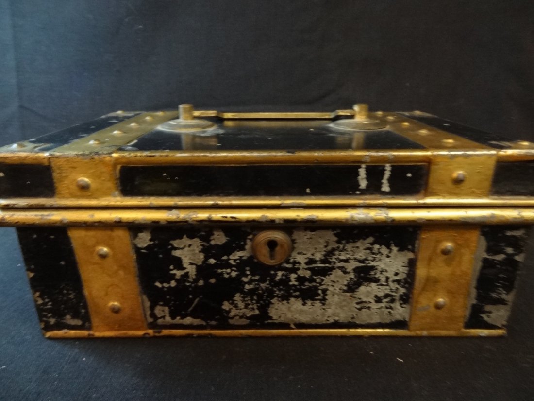 VINTAGE PADLOCK AND BLACK AND BRASS METAL BOX WITH THRE: VINTAGE PADLOCK AND BLACK AND BRASS METAL BOX WITH THREE COMPARTMENT PULL OUT TRAY, APPROXIMATELY 6'' X 10'', INCLUDES KEY TO OUTSIDE LOCK. GOOD CONDITION EXCEPT ONE HINGE IS BROKEN AND PAINT SHOWS SO