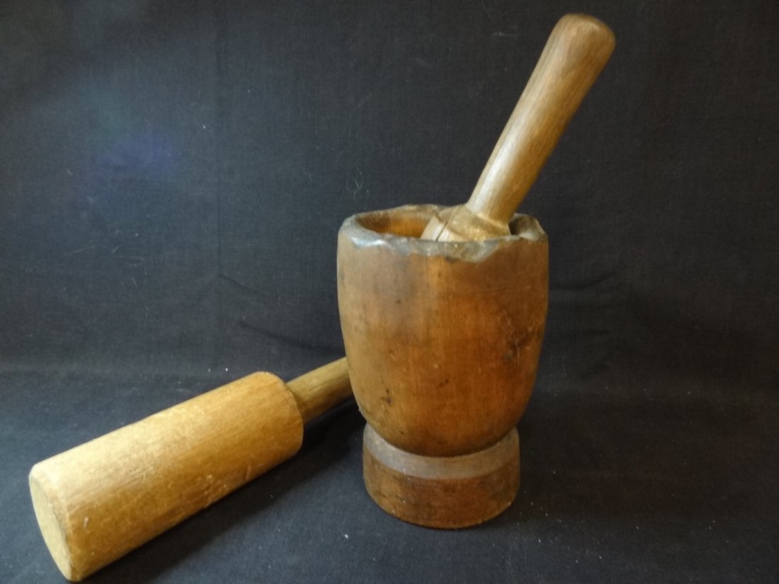WOOD MORTAR AND PESTLE WITH EXTRA PESTLE. MORTAR MEASU: WOOD MORTAR AND PESTLE WITH EXTRA PESTLE. MORTAR MEASURES 7'' TALL AND PESTLE MEASURES 8.5'' TALL. THE EXTRA PESTLE MEASURES 10.5'' TALL. GOOD VINTAGE CONDITION.