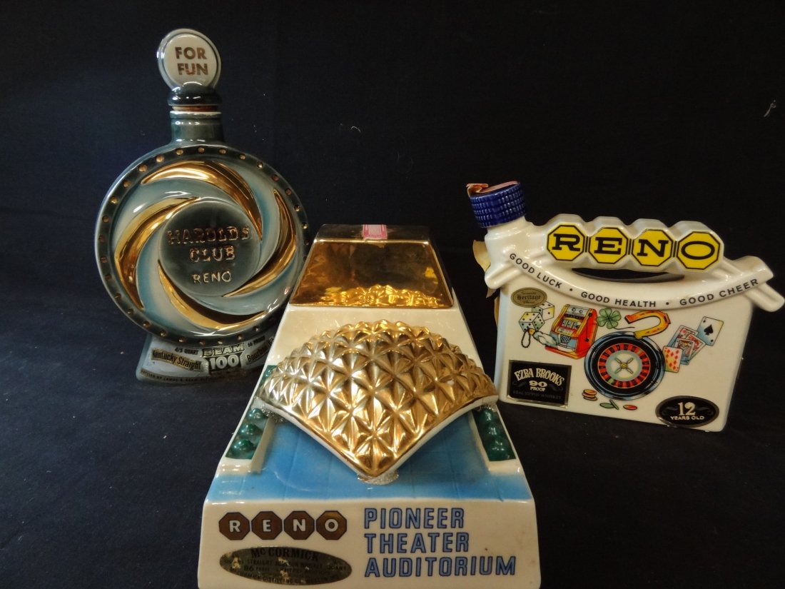 THREE VINTAGE DECANTERS: 1968 RENO, EZRA BROOKS WHISKEY: THREE VINTAGE DECANTERS: 1968 RENO, EZRA BROOKS WHISKEY, 6.5'' TALL; HAROLD'S CLUB, RENO, JIM BEAM, 10.5'' TALL; AND MCCORMICK WHISKEY RENO PIONEER THEATER AUDITORIUM DECANTER, 5.5'' TALL X 6'' DEEP, 