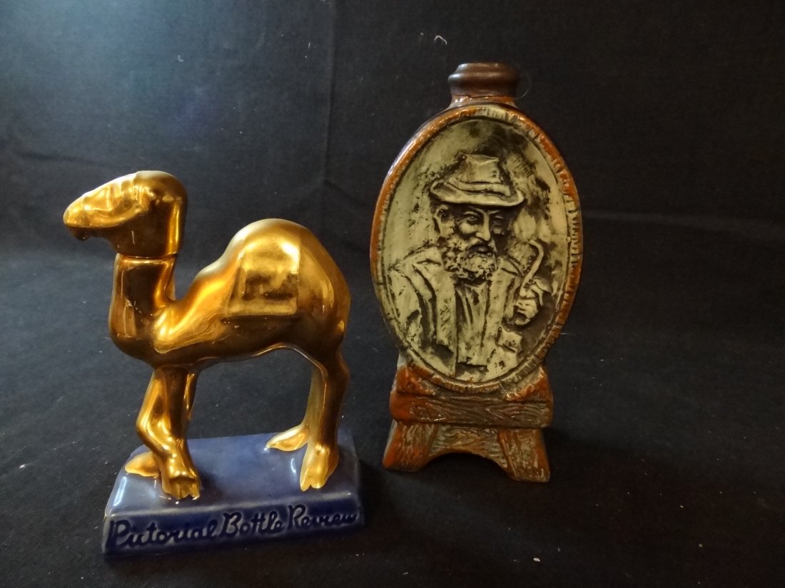 TWO VINTAGE MINIATURE LIQUOR BOTTLES: 1) KEG WITH EMBOS: TWO VINTAGE MINIATURE LIQUOR BOTTLES: 1) KEG WITH EMBOSSED OLD MAN, 2 OZ., 6.5'' TALL, 2) ELMER, PICTORIAL BOTTLE REVIEW, 5'' TALL, 1973. GOOD CONDITION.