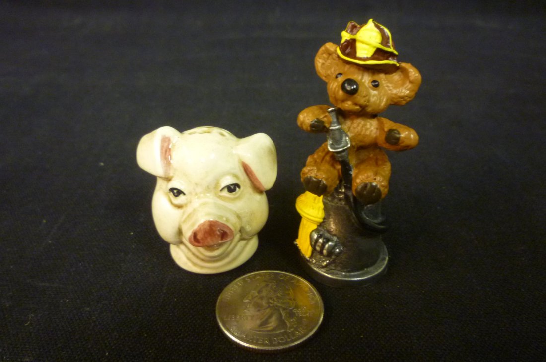 TWO THIMBLES OF A TEDDY BEAR AND PIG HEAD.: TWO THIMBLES OF A TEDDY BEAR AND PIG HEAD.