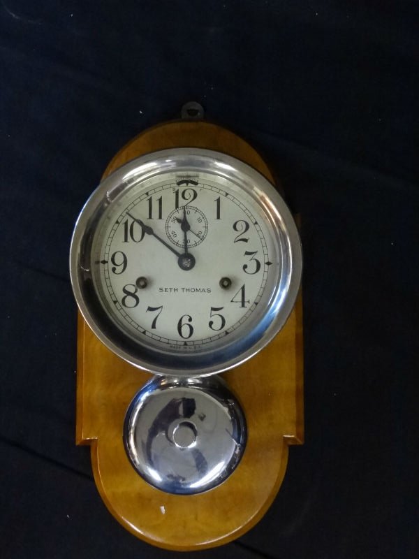 SETH THOMAS WALL CLOCK, LARGE CHROME ENCASEMENT WITH CH: SETH THOMAS WALL CLOCK, LARGE CHROME ENCASEMENT WITH CHROME EXTERIOR BELL, WOOD BASE. 16'' X 8''. WEIGHS 6 LBS. TAHSAC IS NOT EQUIPPED TO SHIP THIS ITEM. PLEASE CALL FOR LOCAL SHIPPING COMPANY'S CONTA