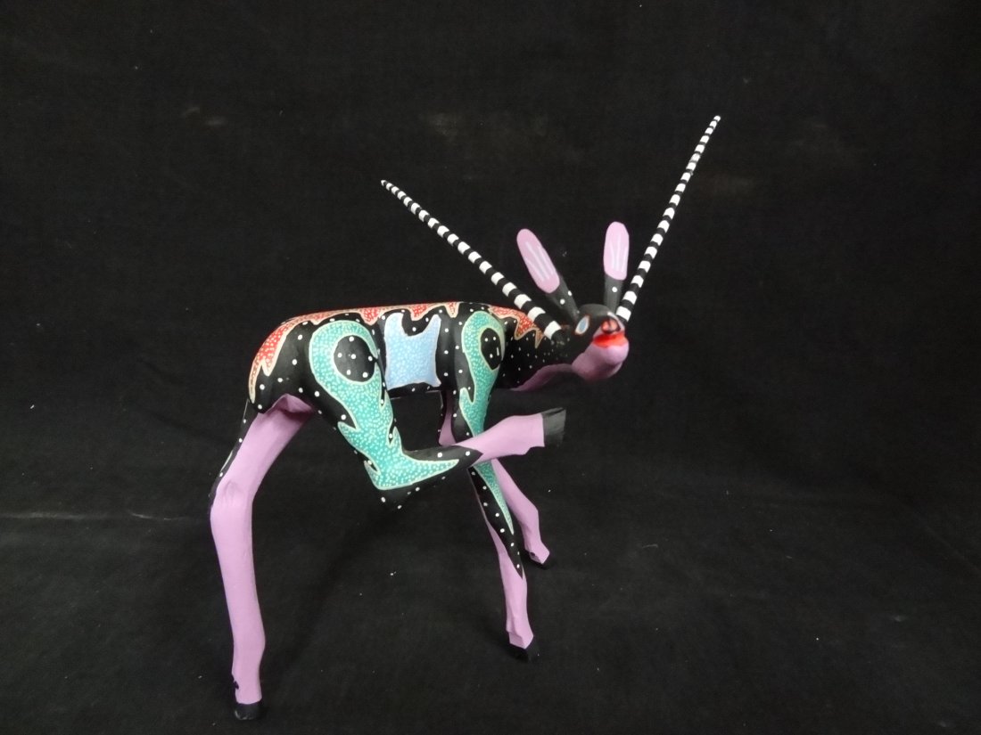OAXCAN WOOD CARVING FOLK ART OF AN ANTELOPE, SIGNED JES: OAXCAN WOOD CARVING FOLK ART OF AN ANTELOPE, SIGNED JESUS MELEHOR, 8.5'' X 9'' THE EARS AND ANTLERS ARE REMOVABLE AND WILL BE SHIPPED IN FIVE PIECES.