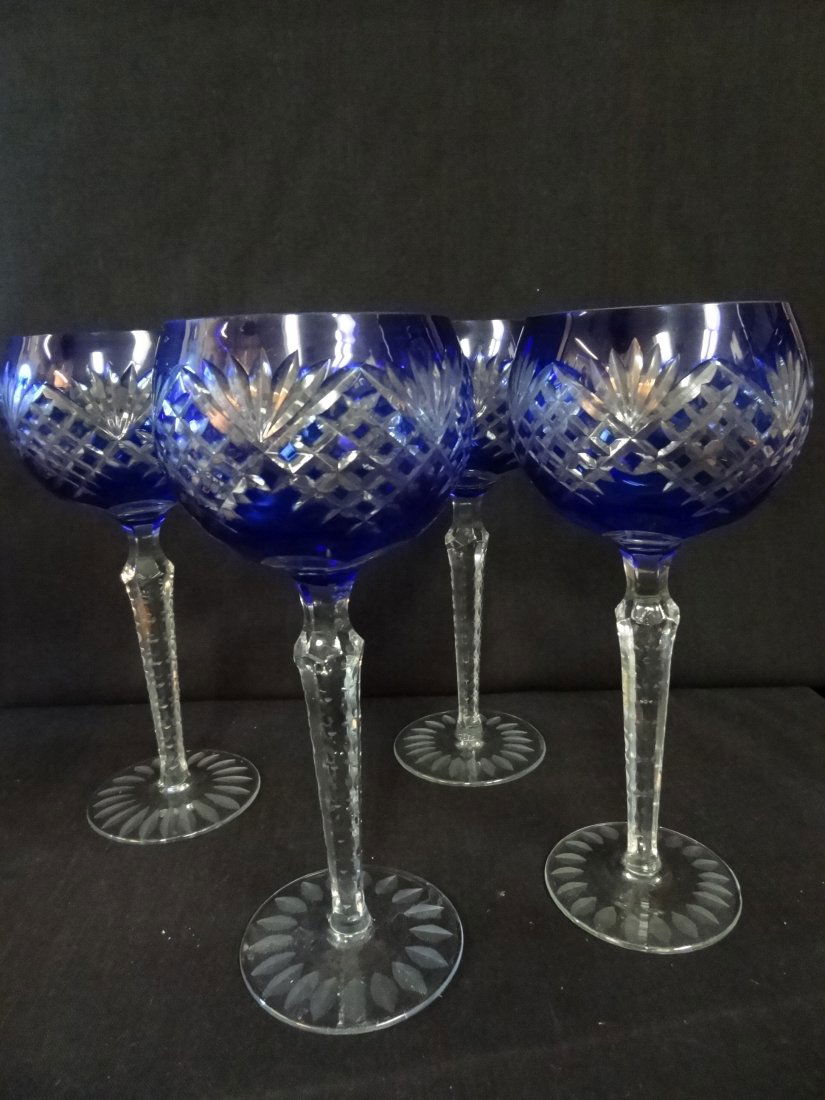 BLUE CRYSTAL CUT TO CLEAR GLASS 4 EACH 8 1/2'' LONG STE: BLUE CRYSTAL CUT TO CLEAR GLASS 4 EACH 8 1/2'' LONG STEM WINE GLASSES. EXCELLENT CONDITION.