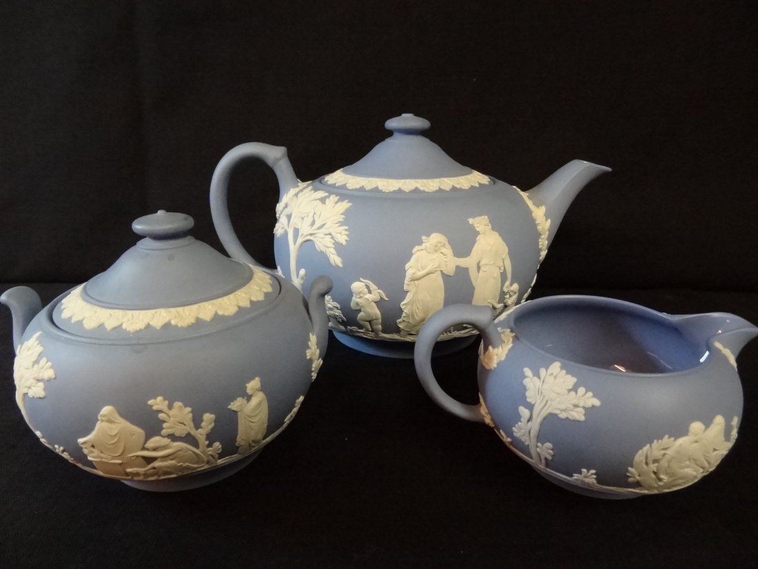 WEDGWOOD JASPERWARE TEAPOT, SUGAR AND CREAMER. TEAPOT 5: WEDGWOOD JASPERWARE TEAPOT, SUGAR AND CREAMER. TEAPOT 5'' TALL, SUGAR 4'' TALL, CREAMER 2 1/4'' TALL. EXCELLENT CONDITION, ALL THREE PIECES ARE GLAZED INSIDE.