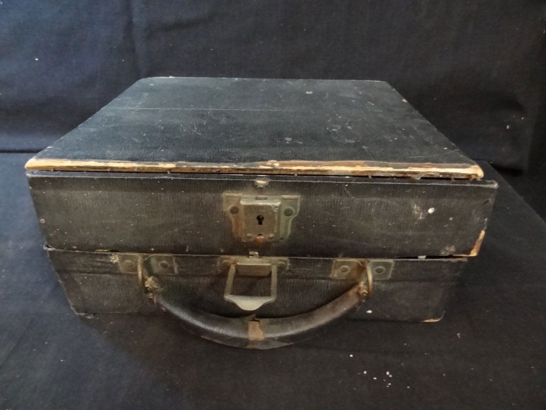 OLD CORONA PORTABLE TYPEWRITER WITH CARRYING CASE, CARB: OLD CORONA PORTABLE TYPEWRITER WITH CARRYING CASE, CARBON RIBBON, KEYS MOVE, WHITE KEYS WITH BLACK LETTERS, FOLDING CARRIAGE, ORIGINALLY FROM BOSTON, MASS. CASE IN FAIR CONDITION WITH BROKEN FRONT PAN