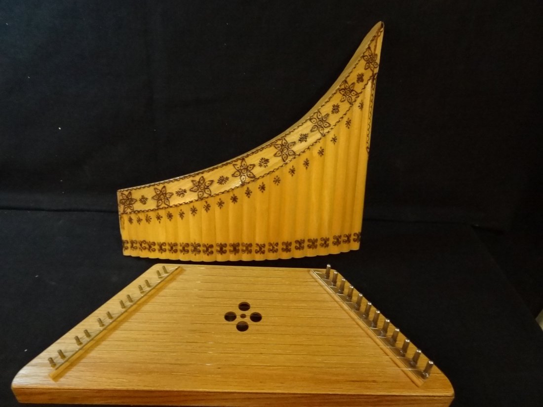 WILLIAM REES LAP HARP FROM OAKHURST, CA. HANDMADE BAMBO: WILLIAM REES LAP HARP FROM OAKHURST, CA. HANDMADE BAMBOO FLUTE, SOME DAMAGE ON THE BACK LOWER SECTION. THERE ARE SOME HAND CRAFTED DESIGNS ON THE FRONT OF THE FLUTE.