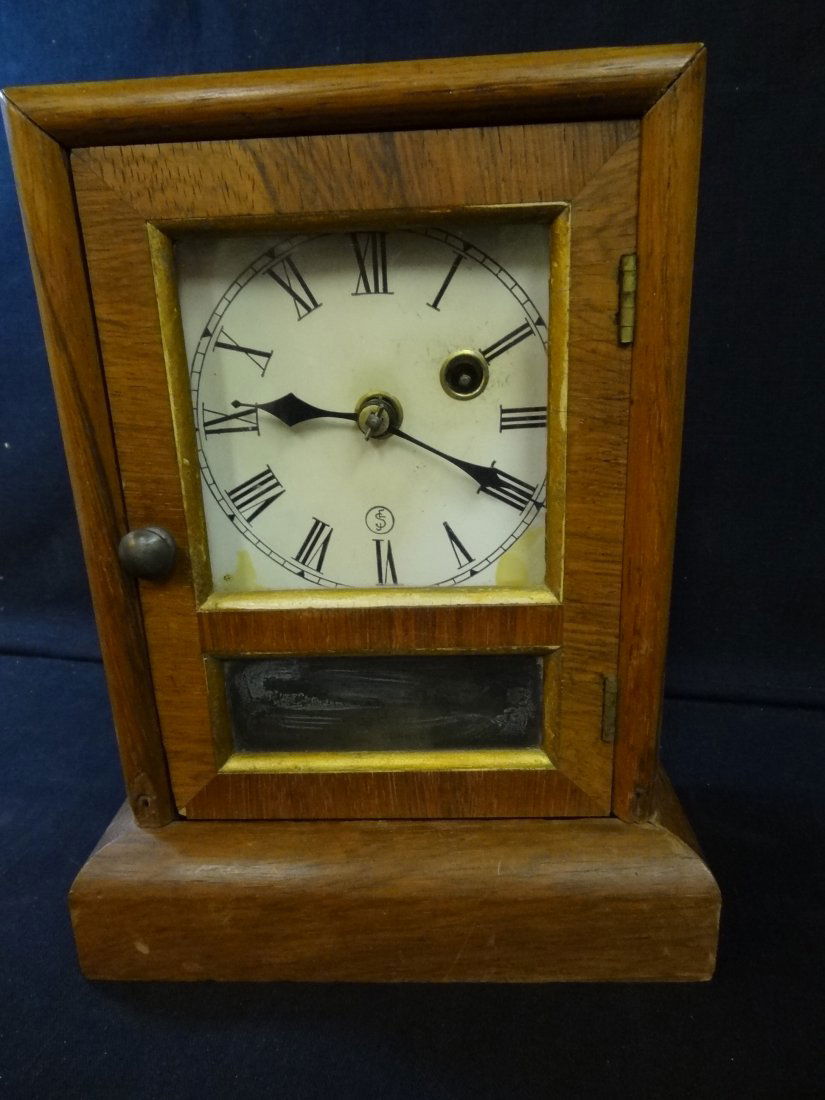 SETH THOMAS MANTLE CLOCK, WOOD CASE WITH GLASS FRONT, S: SETH THOMAS MANTLE CLOCK, WOOD CASE WITH GLASS FRONT, SOME WEAR ON OUTER CASE. CAN BE WALL MOUNTED. FAIR CONDITION, CLOCK FACE NEEDS SOME CARE. MEASURES 7'' X 9 1/2'' X 4''.