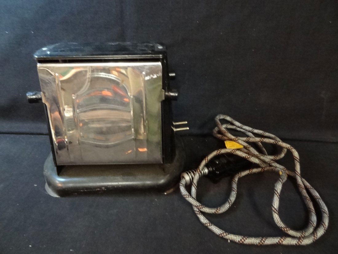 1930'S ELECTRIC TOASTER FROM CAPITAL PRODUCTS N: VINTAGE 1930'S ELECTRIC TOASTER FROM CAPITAL PRODUCTS NO. 50. CHROME AND BLACK METAL. CLOTH COVERED CORD. TWO SIDED TOASTER WITH DROP DOWN SIDES.