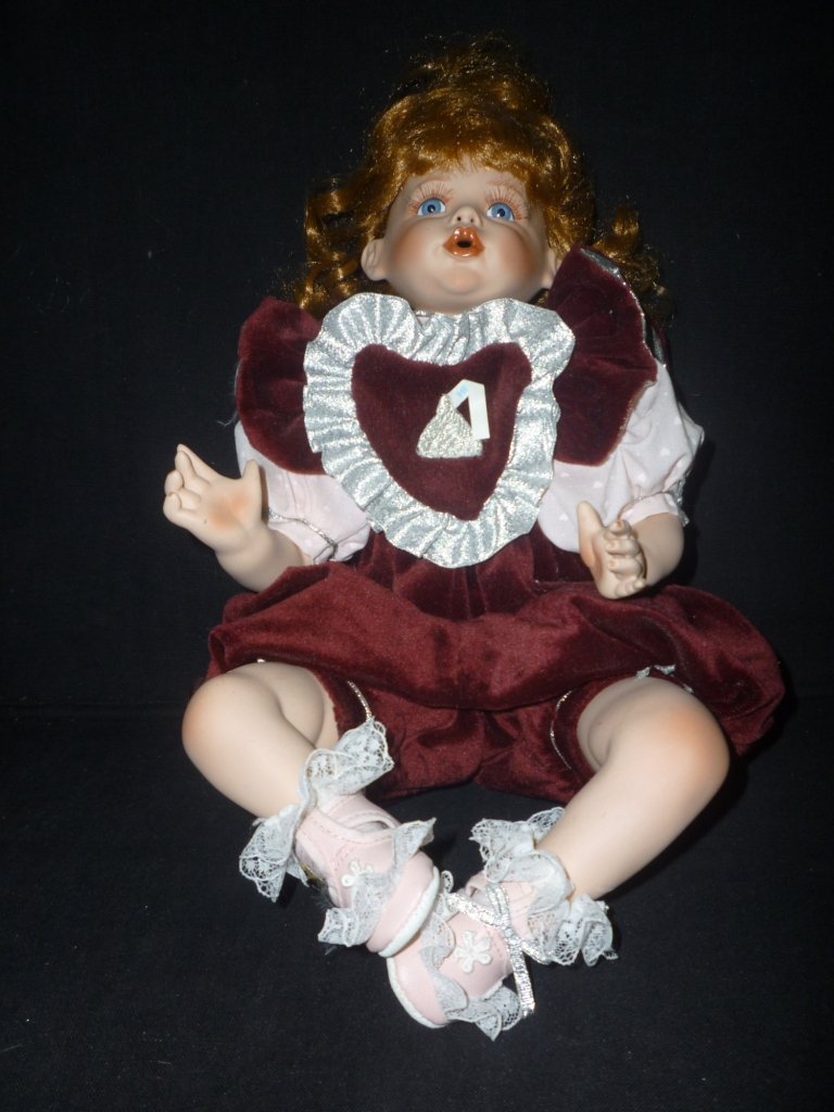 HERSHEY KISS DOLL, BISQUE HEAD SOFT BODY. 17", SIGNED: HERSHEY KISS DOLL, BISQUE HEAD, SOFT BODY. 17" TALL, SIGNED 1997 ANNUAL EDITION.