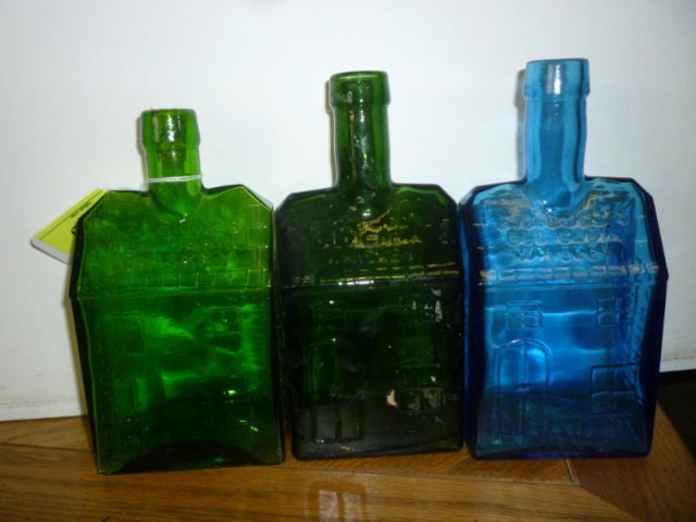 LOG CABIN WHISKEY BOTTLES, 2 GREEN, 1 BLUE EZ BOOZE: LOG CABIN WHISKEY BOTTLES, 2 GREEN, 1 BLUE EZ BOOZE