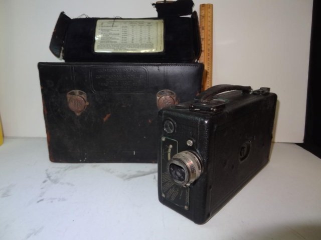 VINTAGE CINE KODAK MOVIE CAMERA WITH BLACK LEATHER: LEATHER CASE. CASE IN POOR CONDITION. CAMERA IN FAIR CONDITION