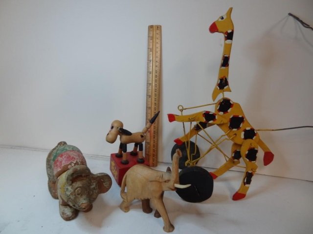 VINTAGE TOYS: INCLUDE MOVABLE GIRAFFE ON WHEELS, BEAR,: BEAR, "TRIX" DOG AND WOOD ELEPHANT (ONE TUSK MISSING)