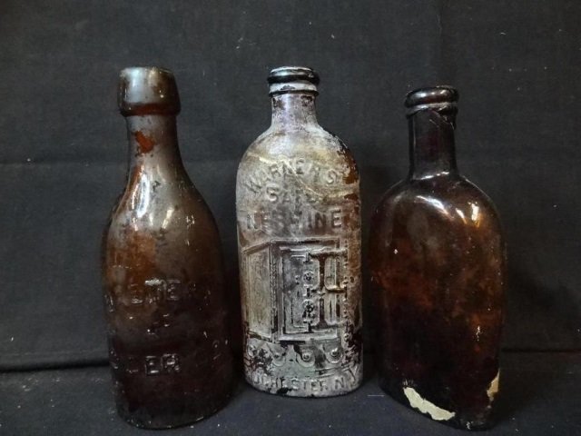 ANTIQUE BOTTLES: WARNERS SAFE NERVINE (OPALESCENT) AND: AND EASTERN CIDER COMPANY. ONE UNMARKED. ALL AMBER GLASS