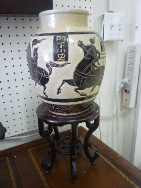 VASE WITH DISPLAY STAND: ASIAN STYLE IMAGES OF WARRIORS: WARRIORS ON HORSES AND SYMBOLS, APPROX. 28" TALL ON STAND
