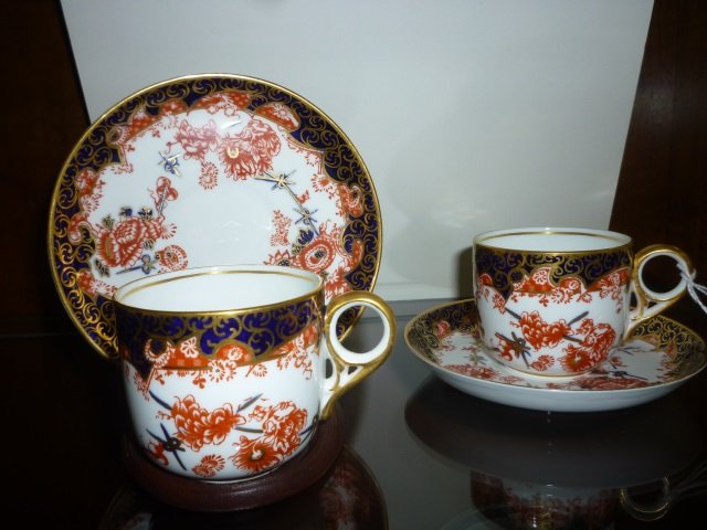 TEA CUPS AND SAUCERS: SET OF 2 WITH ONE DISPLAY STAND,: STAND, BY ROYAL CROWN DERBY ENGLAND
