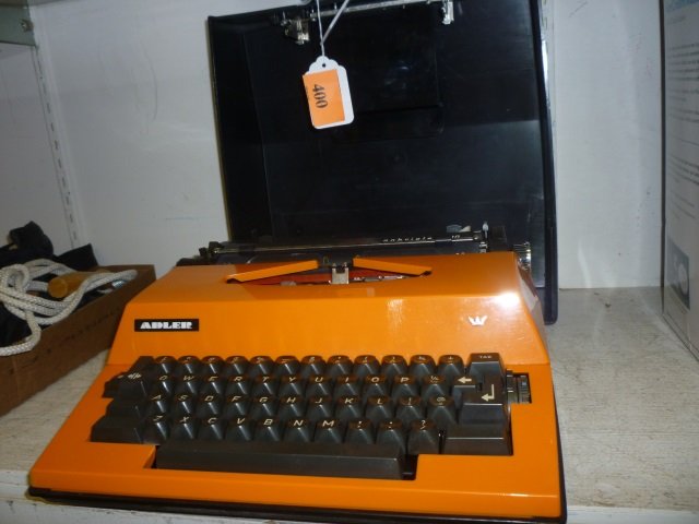 ADLER TYPEWRITER: GABRIEL 2000, ORANGE AND BLACK, WITH: WITH CARRYING CASE