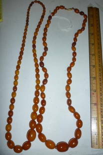 AMBER LIKE NECKLACES 2 NECKLACES WITH GRADUATE BEADING: 2 NECKLACES WITH GRADUATE BEADING