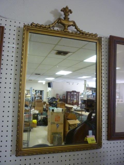 ANTIQUE MIRROR: GOLD TONED FRAME WITH DECORATION ON: ON TOP, CORNER OF FRAME IS BROKEN