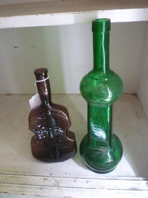 ANTIQUE BOTTLES: PURPLE GLASS VIOLIN AND GREEN GLASS: GLASS BOTTLE.