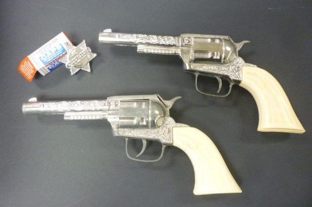 PAIR OF PONY BOY CAP GUNS, TOY SHERIFF BADGE AND BOX OF: AND BOX OF CAPS