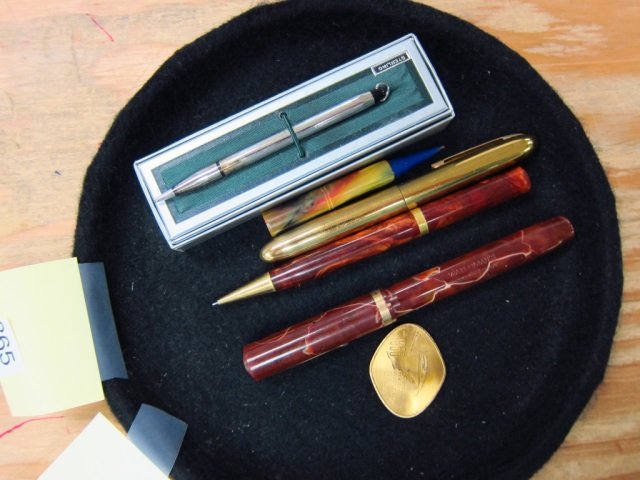 2 FOUNTAIN PENS & 3 PENCILS GM MEDALLION WATERMANS: WATERMANS IDEAL FOUNTAIN PEN, WEAREVER GOLD TONES FOUNTAIN PEN, BROWN AND GOLD TONED PENCIL PENCIL, STERLING SILVER PANCIL WITH BOX, GOLD TONED GENERAL MOTORS MEDALLION 1955