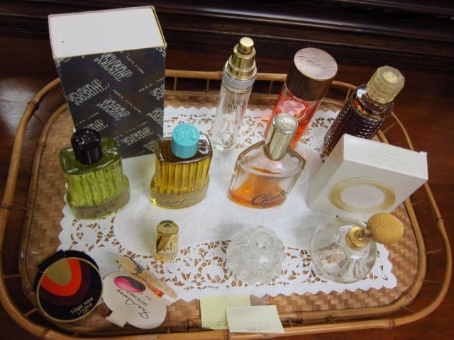 LOT OF PERFUME BOTTLES 9 BOTTLES OF PERFUME; MEMORABLE,: 9 BOTTLES OF PERFUME; MEMORABLE, CHARLIE, CONFETTI, TWEED, FABERGE, RAPTURE, BEAUTIFUL, FABERGE, WHITE DIAMOND (EMPTY) AND 2 PERFUME BOTTLES ON TOP ON ONE (EACH BOTTLE HAS SOME PERFUME INSIDE)
