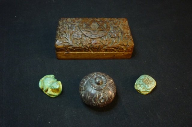 CARVED BOX, JAR & BEADS LOT COMPRISED OF 4" BY 2": LOT COMPRISED OF 4" BY 2" CARVED WOOD BOX WITH STAR OF DAVID & FLOWER MOTIF(HINDGES ARE A LITTLE LOOSE), CARVED STONE BEADS STAINED WITH BLUE/GREEN COLOR - ONE SCARAB & ONE FROG, CARVED STONE JAR APPR