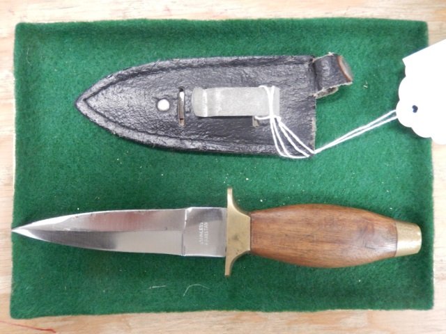 KNIFE FROM PAKISTAN SMALL KNIFE WITH WOOD HANDLE AND: SMALL KNIFE WITH WOOD HANDLE AND LEATHER CASE. MARKED "STAINLESS STEEL, MADE IN PAKISTAN." APPROX 7.5' LONG FROM HANDLE TO TIP