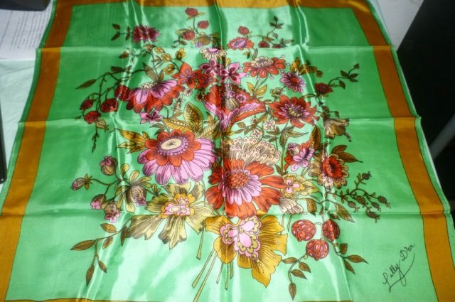 VINTAGE SCARVES, LILLY D'OR LOT OF VINTAGE SCARVES: LOT OF VINTAGE SCARVES INCLUDES 1 GREEN & GOLD FLORAL SCARF BY LILLY D'OR, 1 NEW RAIN SCARF, 4 LONG NECK SCARVES AND 7 OTHER ASSORTED SCARVES. SOME SILK