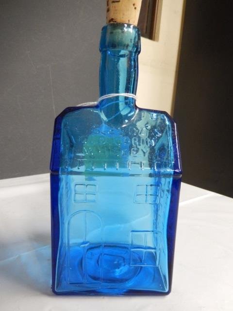 E.C. BOOZ REPRODUCTION WHISKEY VINTAGE BLUE WHISKEY: VINTAGE BLUE WHISKEY BOTTLE. MOST LIKELY REPRODUCTION FOR "E.C. BOOZ'S OLD CABIN WHISKEY" ALSO MONOGRAMMED "120 WALNUT STREET, PHILADELPHIA" AND "E.C. BOOZ OLD CABIN WHISKEY." BOTTLE IS APPROX 4" X 9"